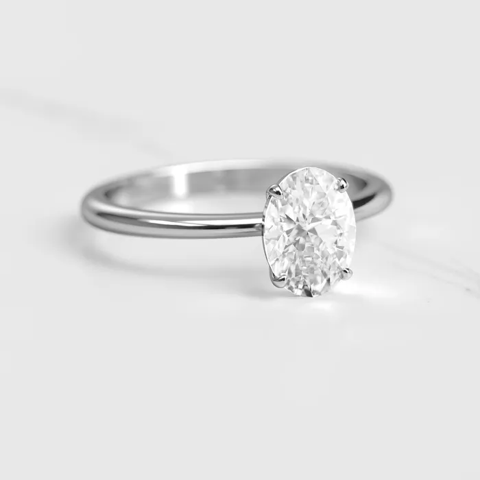 Capucinne Rings Oval Tapered Solitaire Diamond Ring